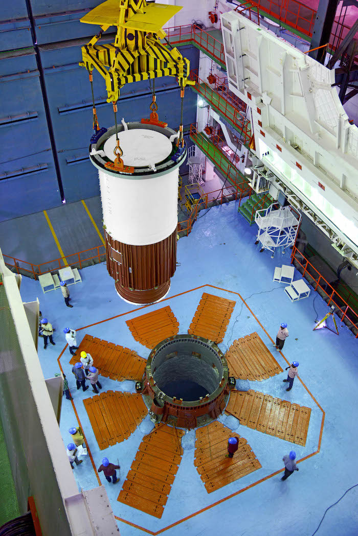 1nozzleendsegmentofpslv-c45corefirststagebeingloweredonmobilelaunchpedestalduringvehicleintegration