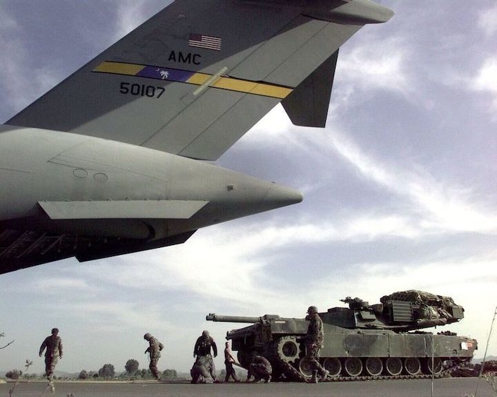 soldiers-and-airmen-lay-down-a-track-of-plywood-as-they-news-photo-1602184269